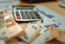 상속세 없이 재산 넘기기, NC 한인이 알아야 할 절세 전략 A calculator sitting on top of a pile of money