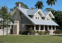 랄리 더럼 공공주택 재개발, 대규모 복합단지로 탈바꿈 A grey house with a stone chimney and porch in Fort Myers, Florida